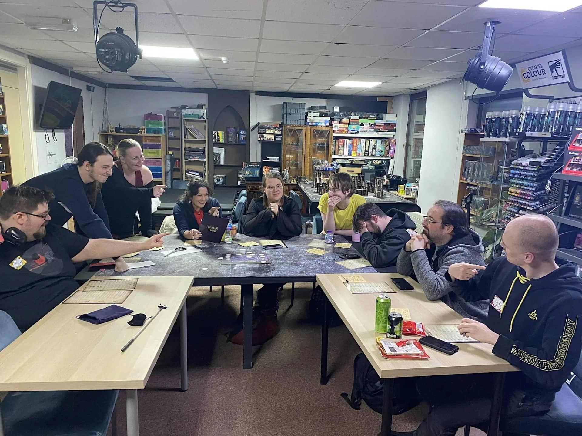 A group of players laughing together during a role-playing session at Nerdvana